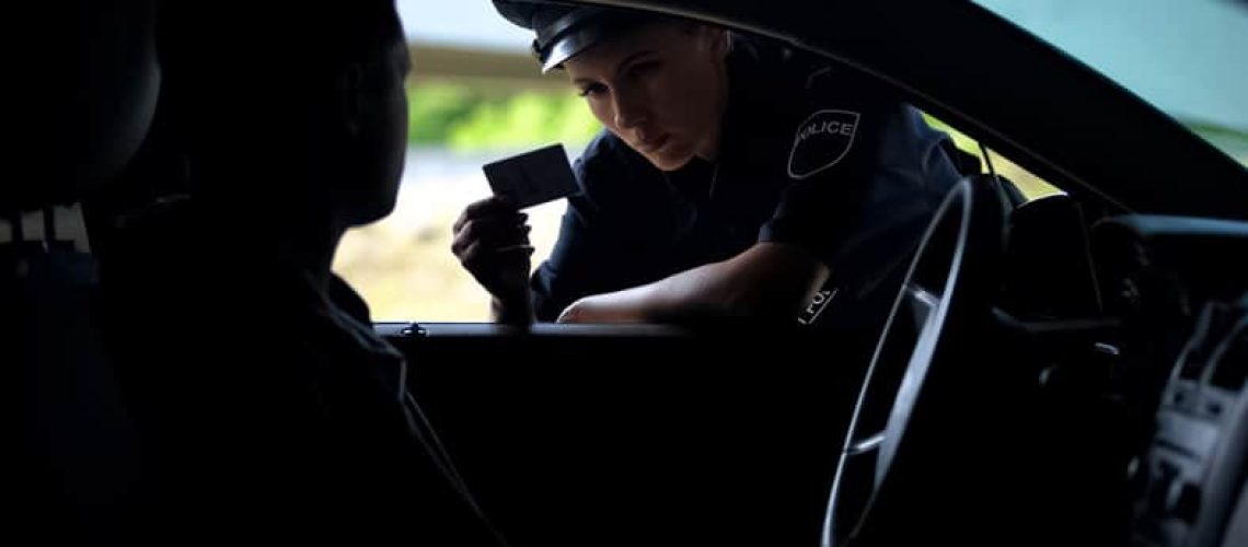 Woman being stopped by a police officer criminal defence lawyers