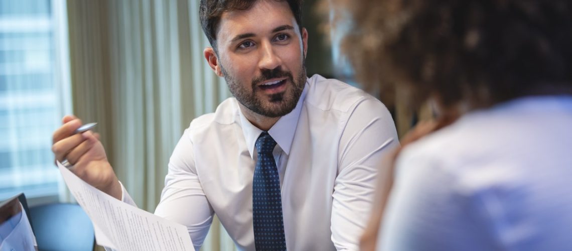 a calgary criminal lawyer holding a pen